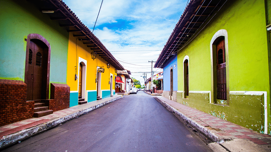 An overview of the colourful buildings in the Latin Quarter, Goa, with a clear view sky.