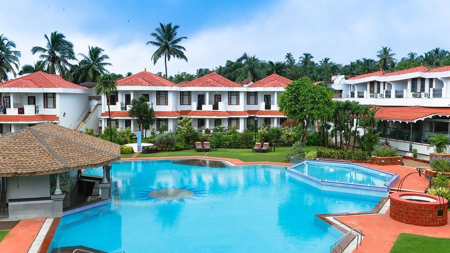 expansive swimming pool at heritage village resort and spa in goa