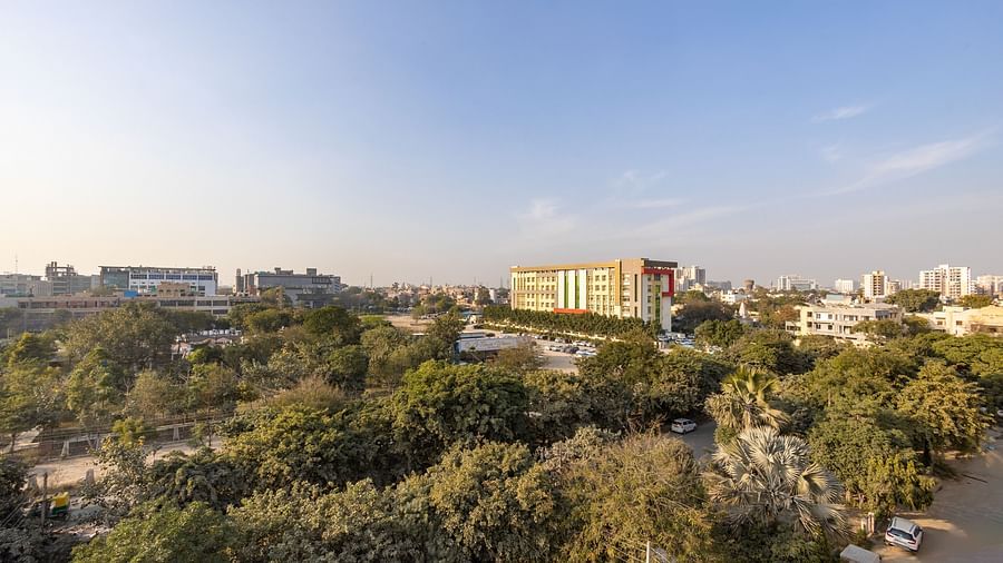 Scenic city view with lush greenery and buildings, seen from Hotel Bawa, Gurgaon.