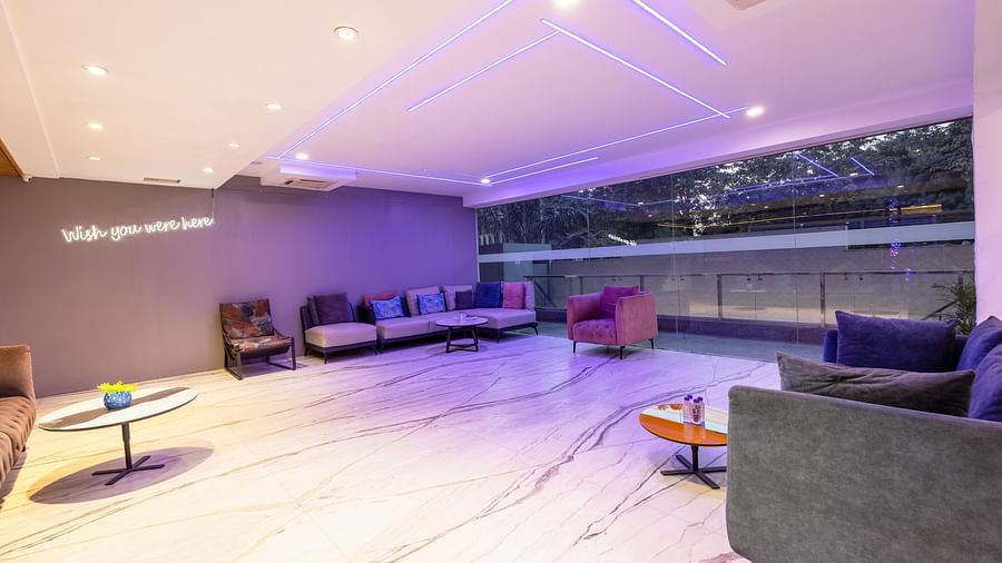 Spacious hotel lounge with sofas and soft lighting at Hotel Bawa, Gurgaon.