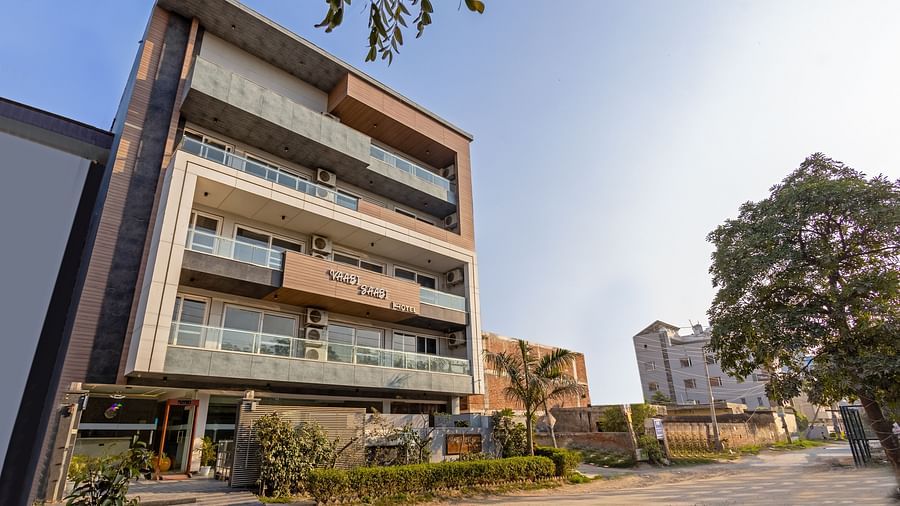 Modern exterior of Hotel Bawa, Gurgaon, with sleek architecture against a clear blue sky.