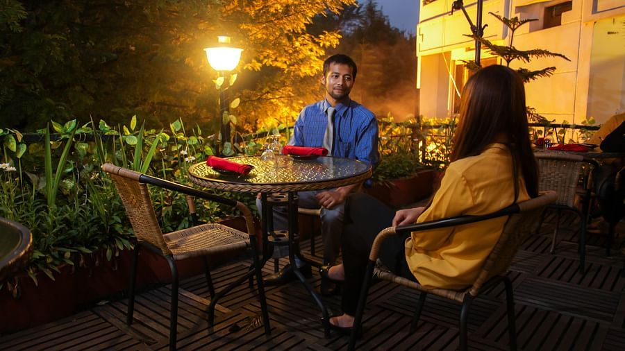 a couple enjoying a dinner at Sky Grill, one of the best Restaurants in Shillong Police Baazar