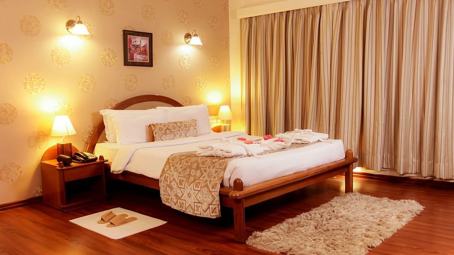 Warmly lit hotel bedroom