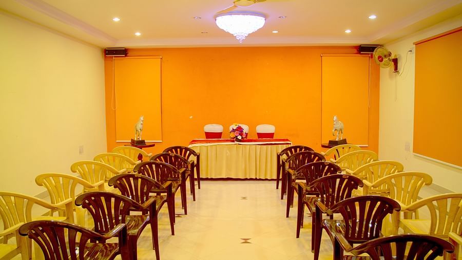  Hall Hotel Yasodha Towers - Interior view of the conference room featuring 4 columns of chairs placed on either sides of the room