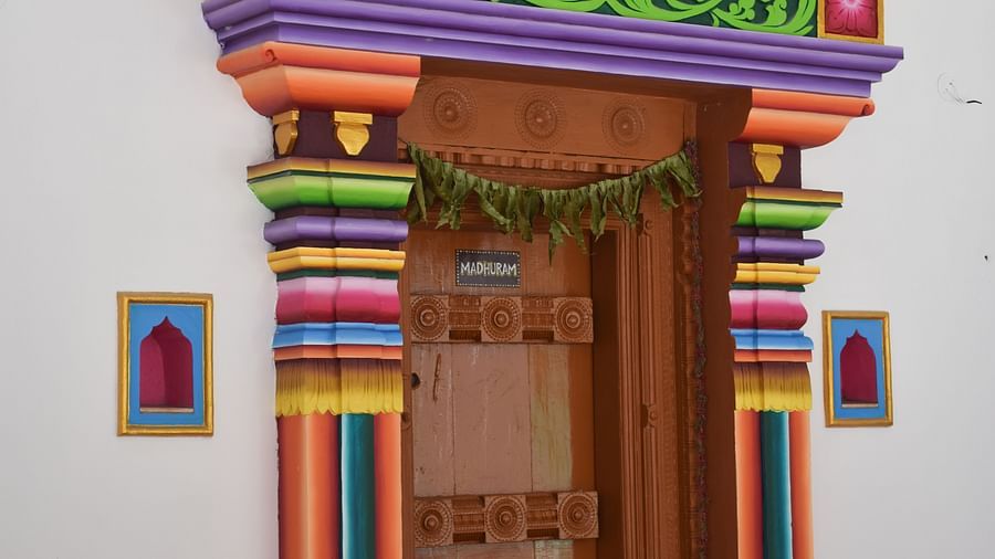 A close-up of a traditional Indian patterned door, with intricate details suggesting cultural or artistic significance.