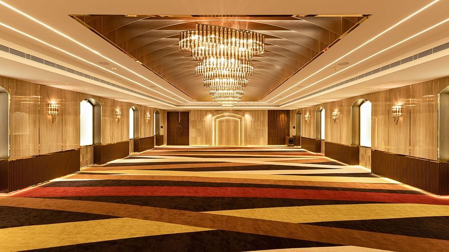 view of an empty hall with chandelier lights2