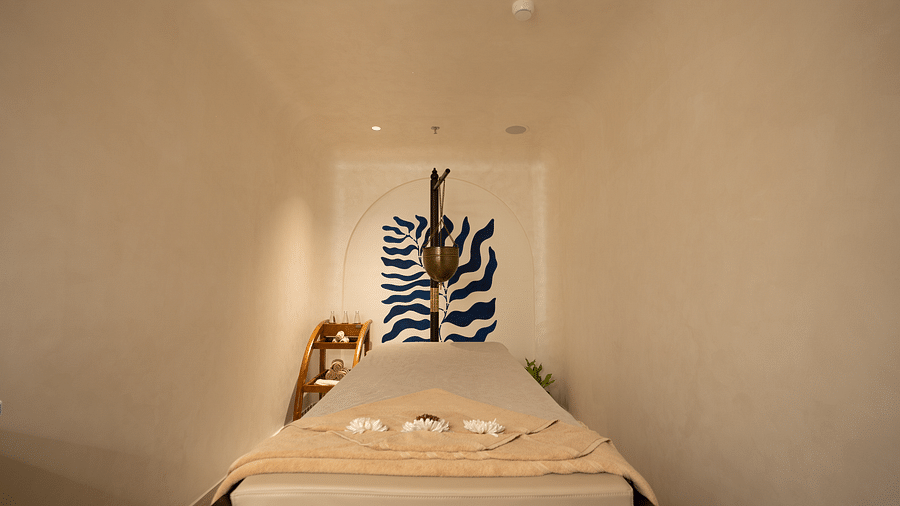 This image showcases a well-made bed with attention to detail, emphasizing comfort and luxury