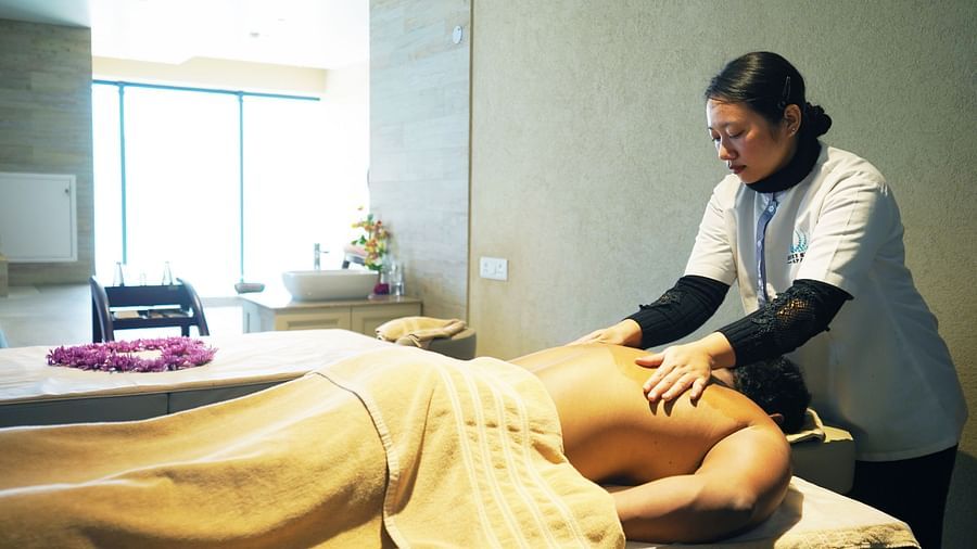 This image depicts a person receiving a massage, highlighting the spa