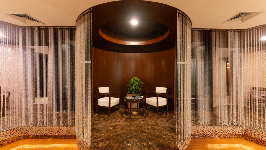 Elegant circular seating alcove enclosed by sheer curtains at Kenilworth Resort & Spa, Goa.