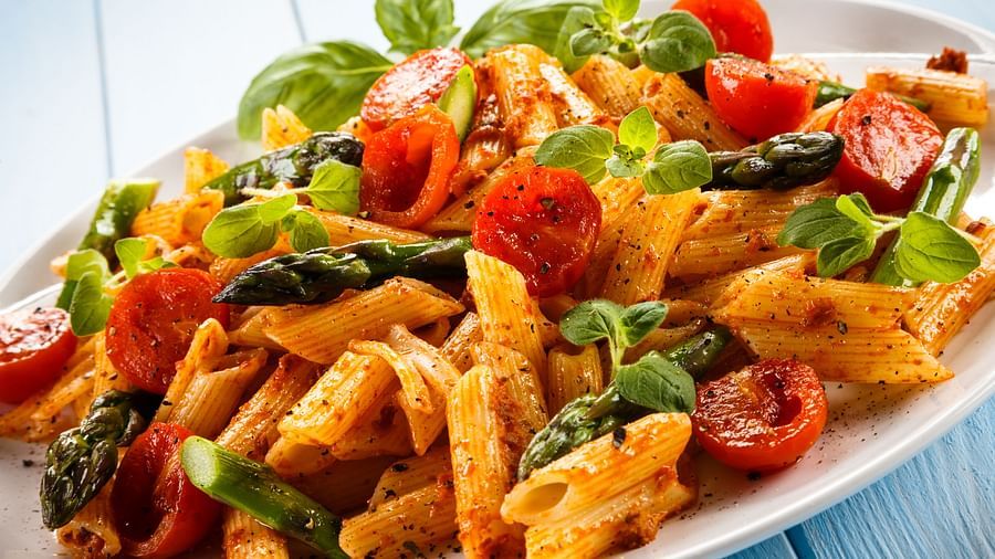 a close up shot of a Pasta plate kept on the table