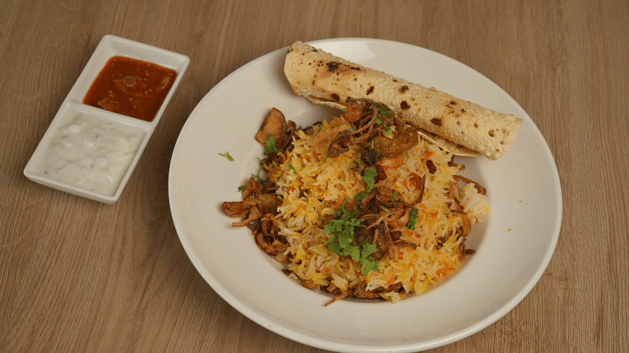 Fragrant rice dish with grilled flatbread and dipping sauces| Dining in Doha at La Maison Hotel