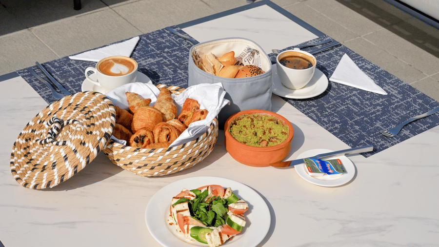 DSC 7468Assorted breakfast dishes with pastries, dips and fresh salad enjoyed al fresco at La Maison Hotel, Doha.