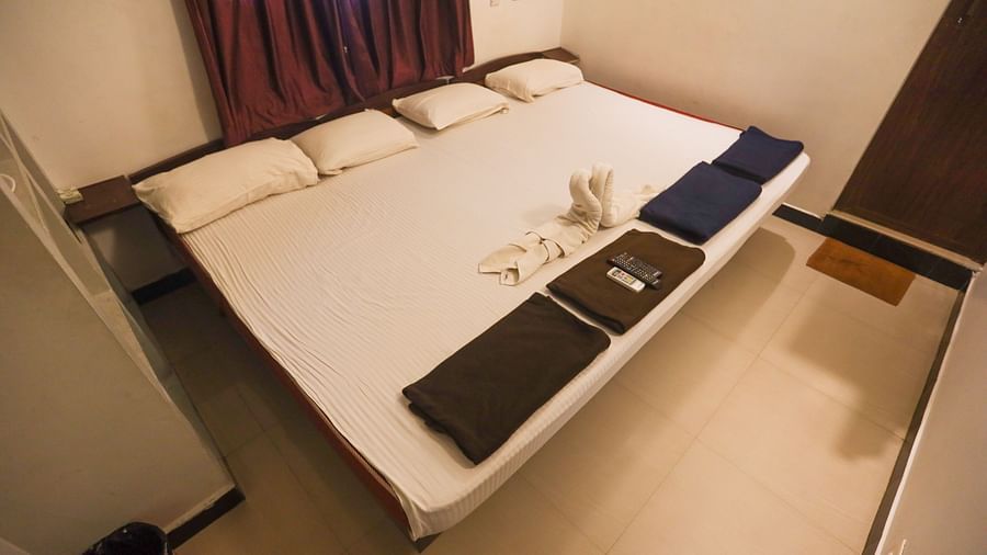 a top corner view of family room with plushy bed, and the cupboard at La Paradise,  Residency 