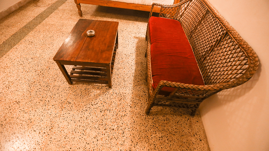  A closeup view of the sitting area in the room with sofa and table at la villas Heritage, pondicherry