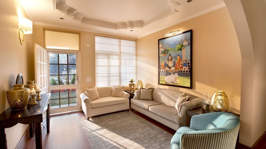 the living room features comfy sofas and large windows 4 - Lamrin Boutique Cottages Rishikesh