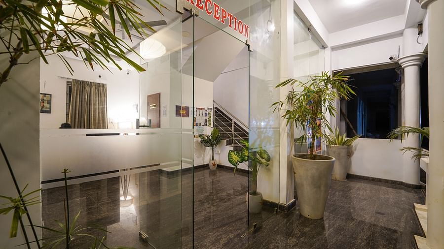 Entrance to the reception area through glass doors - Le Poshe Beachview Pondicherry