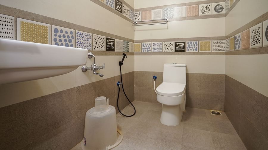 Overview of the bathroom with shower area inside one of the rooms at Le Poshe Beachview Pondicherry