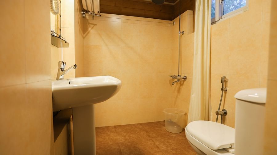 Attached Deluxe Cottage Bathroom- Lotus eco Beach Resort Konark
