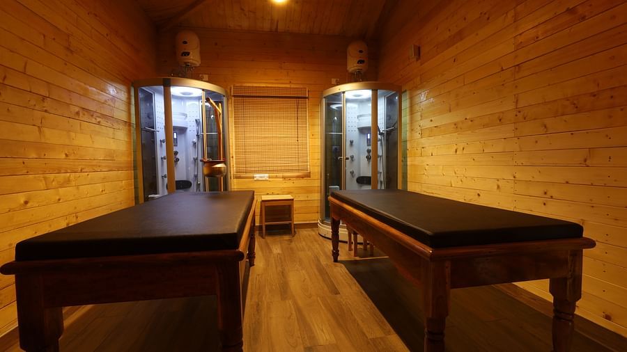 A massage room with two beds at Lotus Eco Beach Resort Konark.
