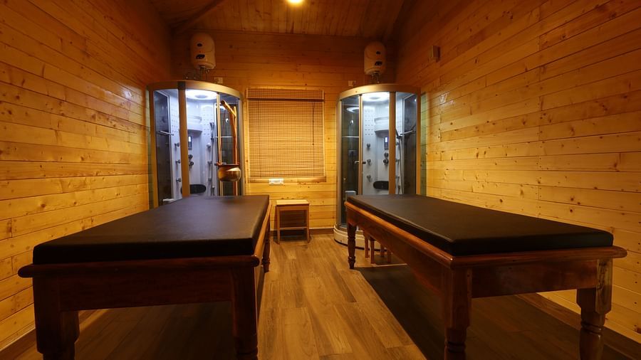 A massage room with two beds at Lotus Eco Beach Resort Konark.
