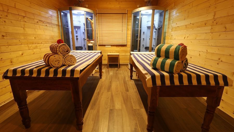 A massage room with two beds at Lotus Eco Beach Resort Konark.