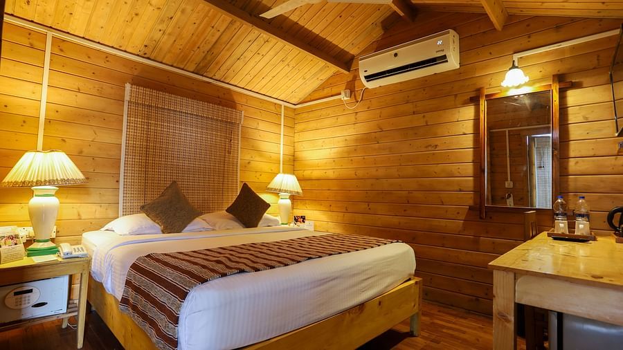 Sea Breeze Cottage at Lotus Eco Beach Resort in Konark with wooden interior  and top-notch amenities