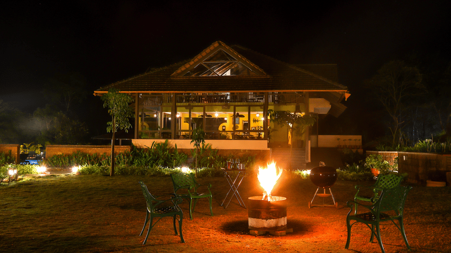 Bonfire evenings at Machaan plantation resort