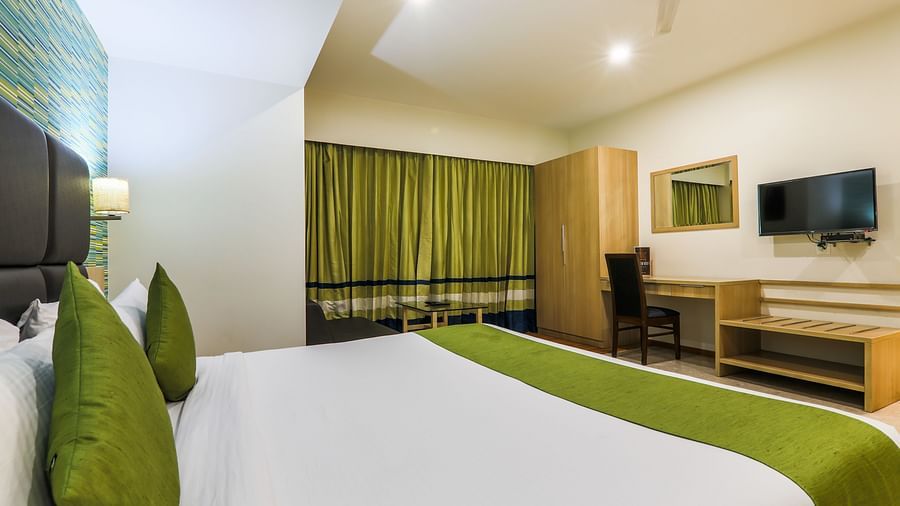 deluxe king room with side view of the bed