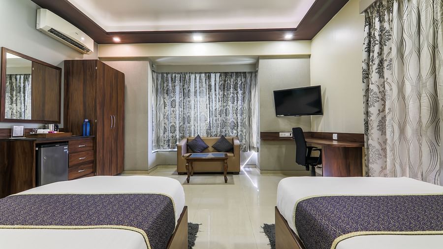 twin bedroom facing sitting area