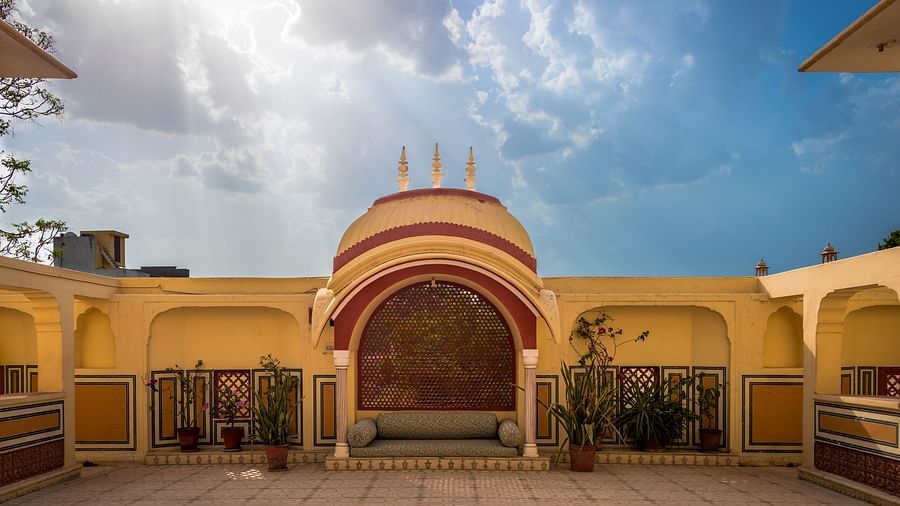 seating arrangement under a canopy with a large open space in front of it - Mandawa Haveli Jaipur