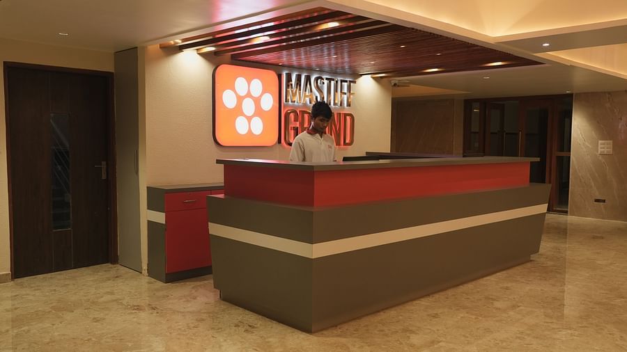  An image of a reception desk with one person being the attendee at  Mastiff Grand, Dharwad