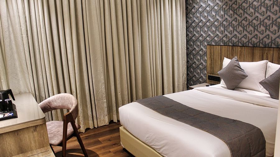 Side view of hotel room with double bed at Maxxvalue Hotel MIDC,  Mumbai