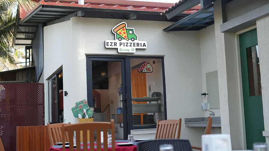 Exterior entrance view of Ezr and Bar with visible signage and tiled roof.