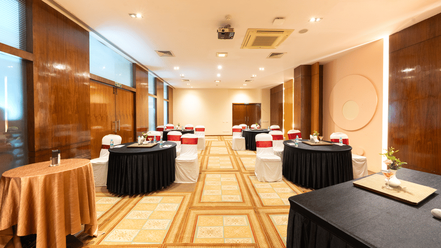 A hall with several decorated tables and a checkered floor. |  MGM Mark Whitefield