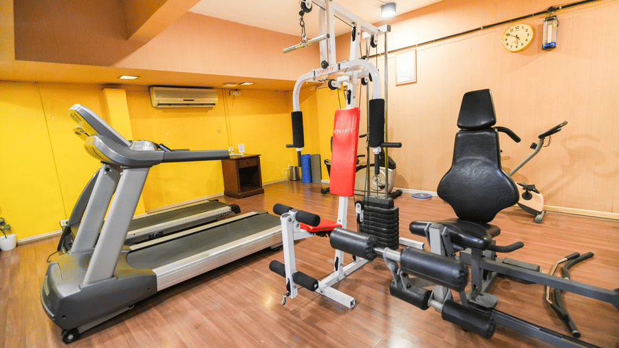 A fitness centre with treadmills and other gym equipments placed in a closed space. | MGM Mark Whitefield