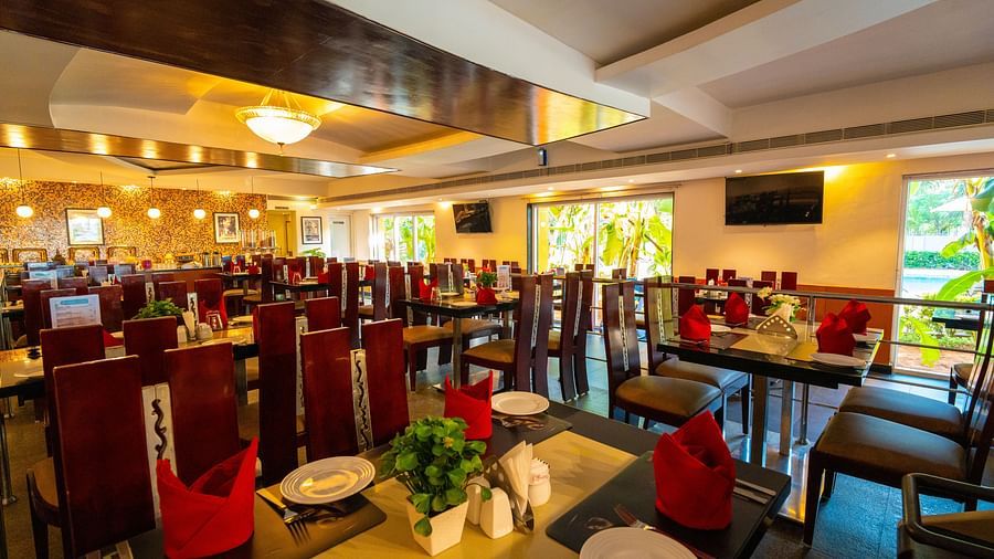 Image of seating arrangements in restaurant and large TVs mounted on the wall