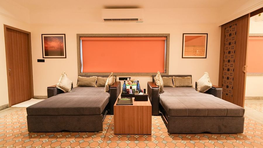 Image of two single beds next to each other with a running table in the middle