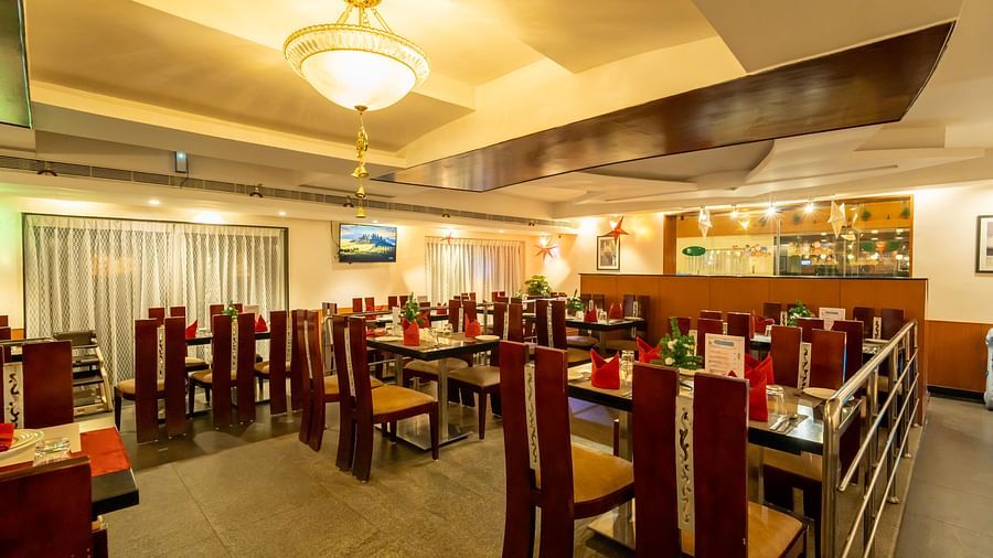 Angular shot of the restaurant with a small chandelier hanging from the ceiling