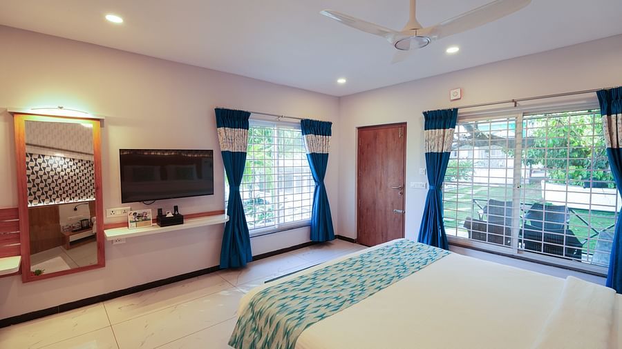 Picture featuring a spacious and inviting bedroom with a large bed and elegant decor -  MGM Whispering Wind's Resorts