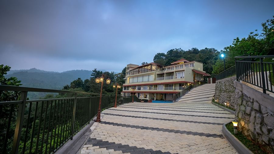 A long shot of a pathway leading to the resort | Misty Queen by Dimora, Kakkadampoyil