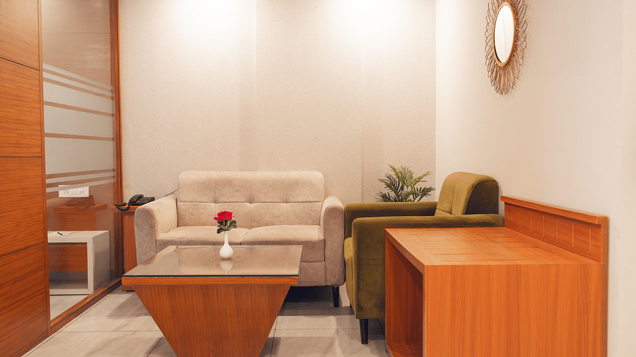 Living area of a Super Deluxe Room at Montclair Ananta, Elite.