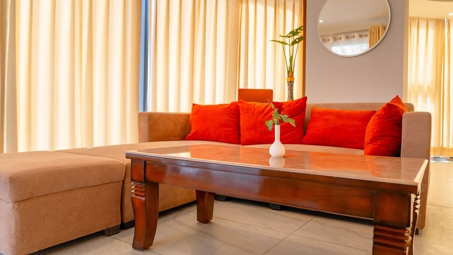 Living area with comfortable sofa of a Standard Room at Montclair Ananta, Elite.