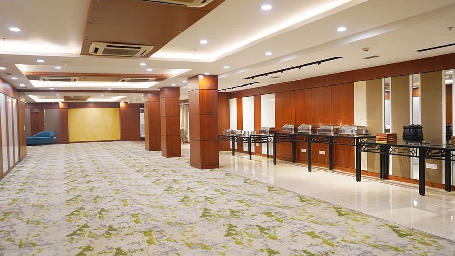 The versatile conference room at Nemesia offers a flexible layout, suitable for various meeting configurations, with a buffet attached.