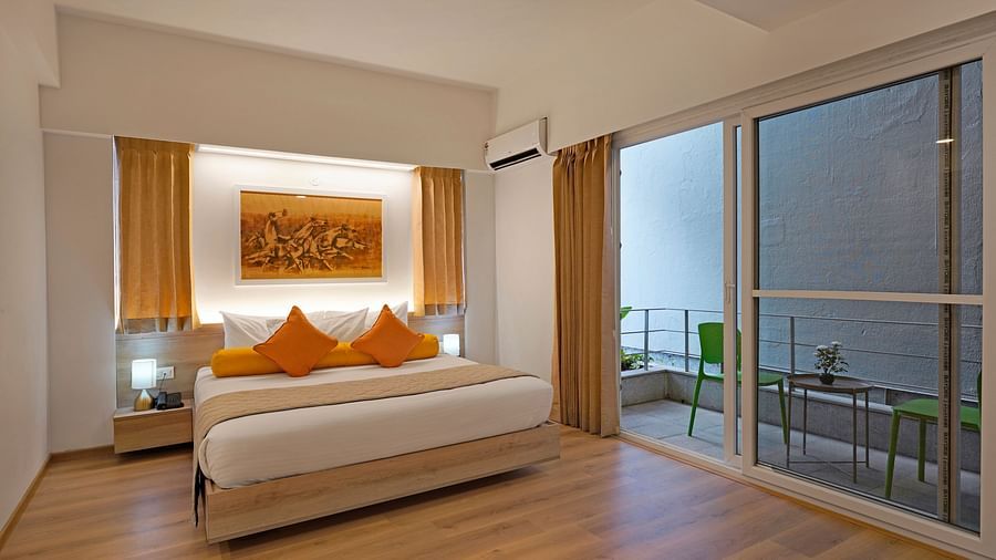 Cosy bed with bed lamps in Studio Premium Room at Nest by Rivido Apart Hotel, Bannerghatta Road