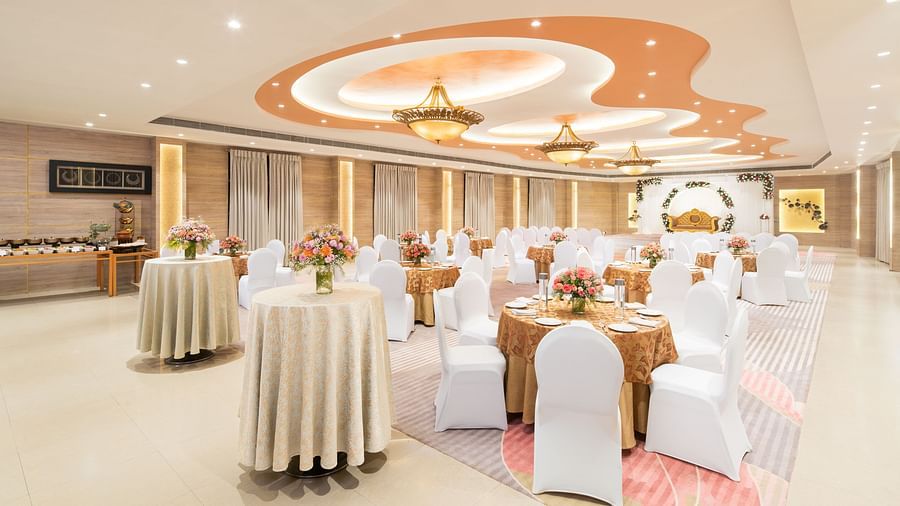 A decorated banquet hall with a high ceiling and elegant furnishings, perfect for hosting events