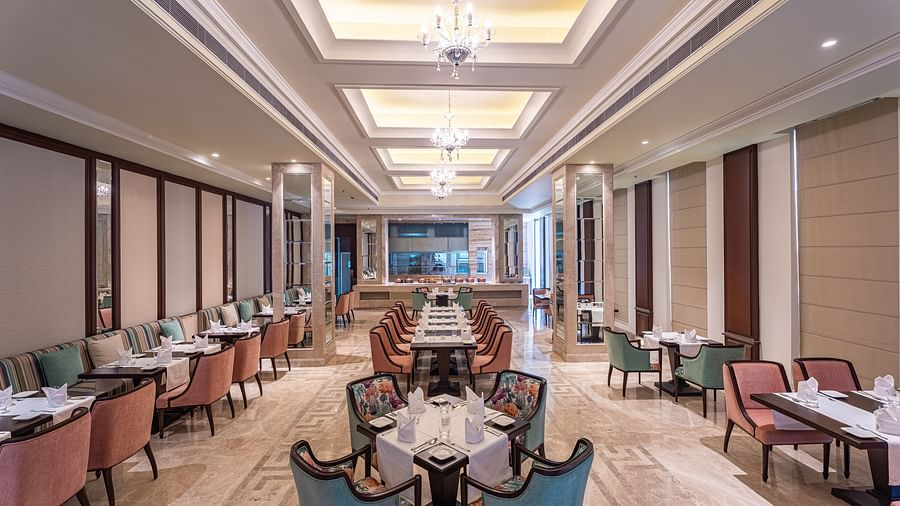 rows of tables and chairs in our restaurant in Jalandhar - Park Plaza, Jalandhar