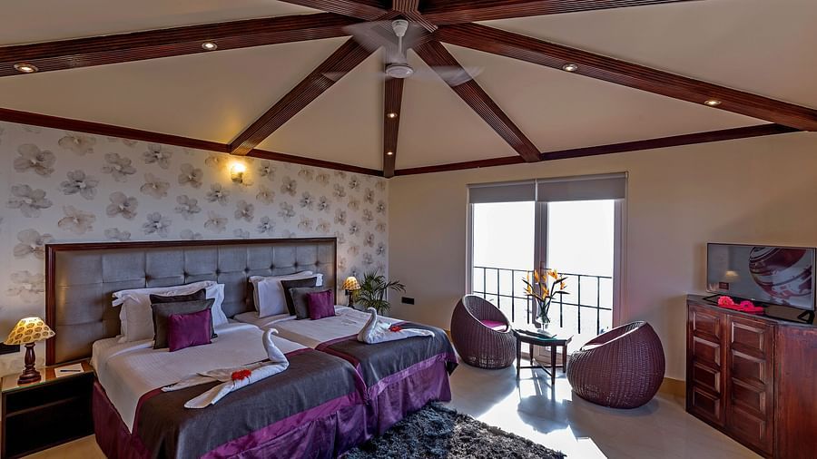 twin bedding with purple sheets and purple bean bags at one of the rooms 3