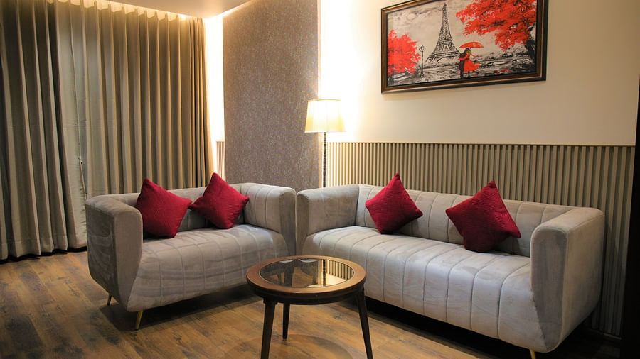 Suite Room with plush sofas and wooden flooring