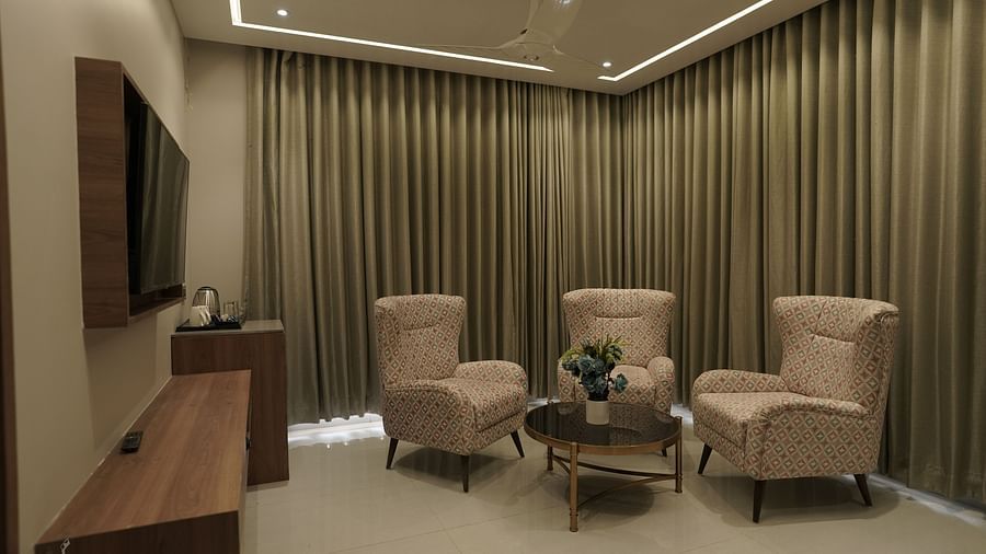 Executive Suite Room Living Area with sofa chairs and a coffee table