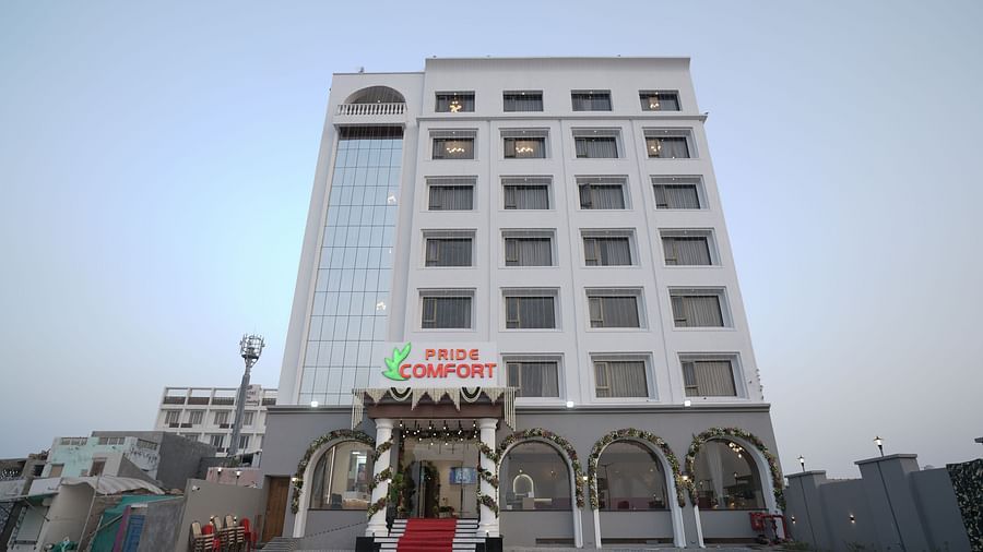 Facade of Pride Comfort, Dwarka during the day